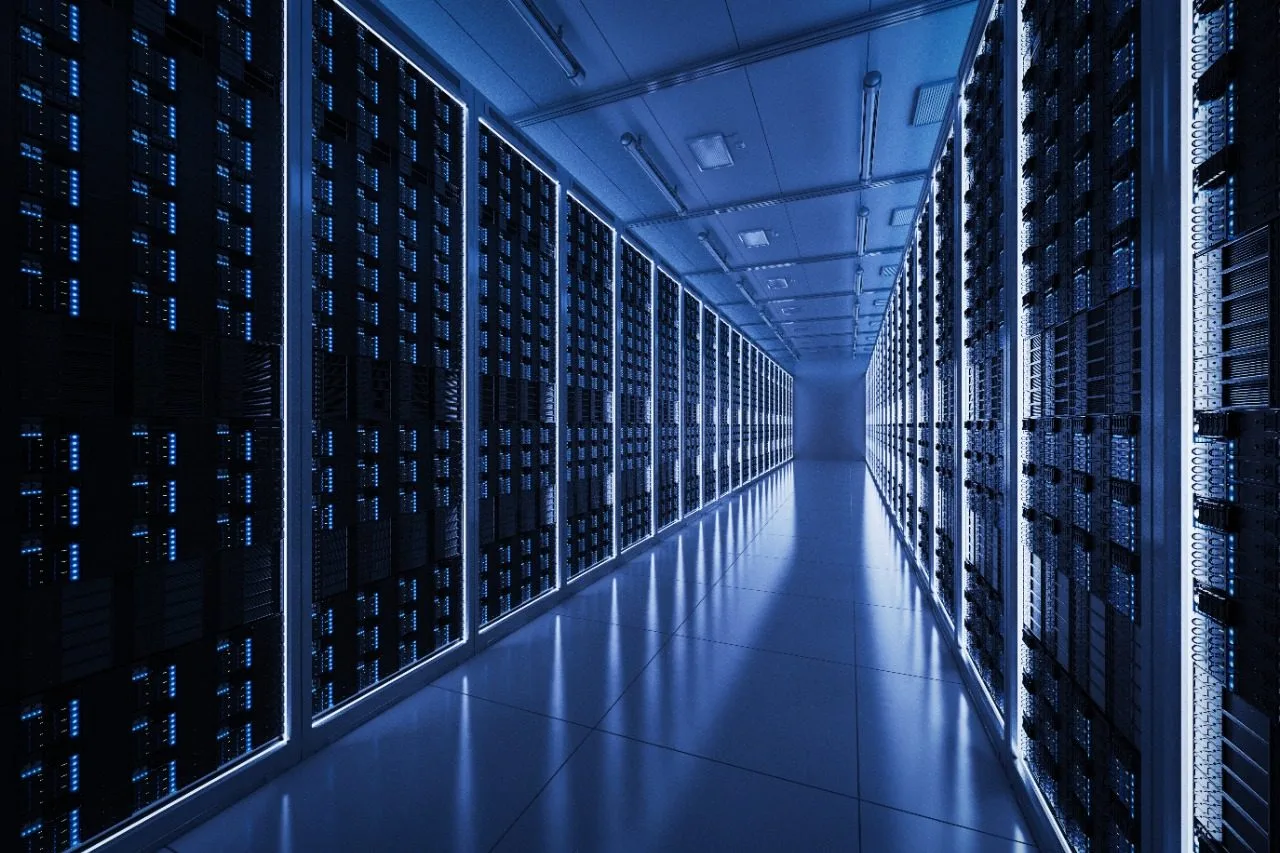 Data centre aisle of illuminated server racks